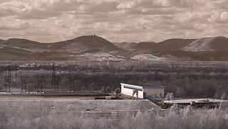 Before spring starts - view of the Marckolsheim power station at the Rhine from the Limberg with the Château du Haut-Kœnigsbourg in the background (infrared)